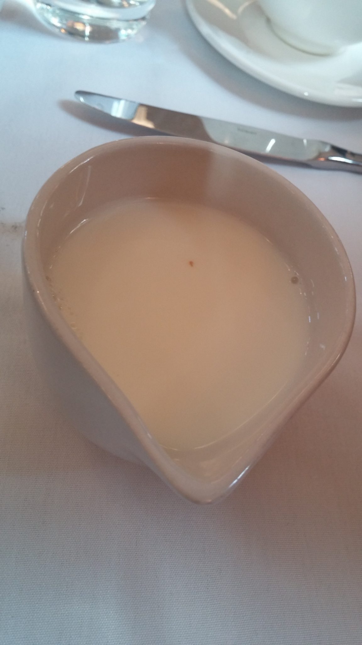 Milk jug with crumb in it
