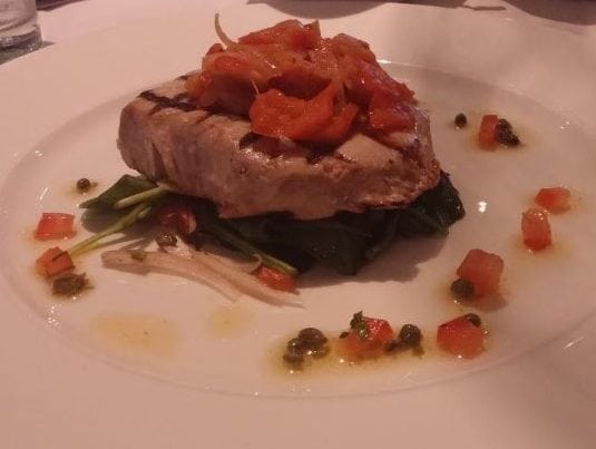 Chargrilled tuna steak, peperonata, spinach leaves, tomato and caper dressing.