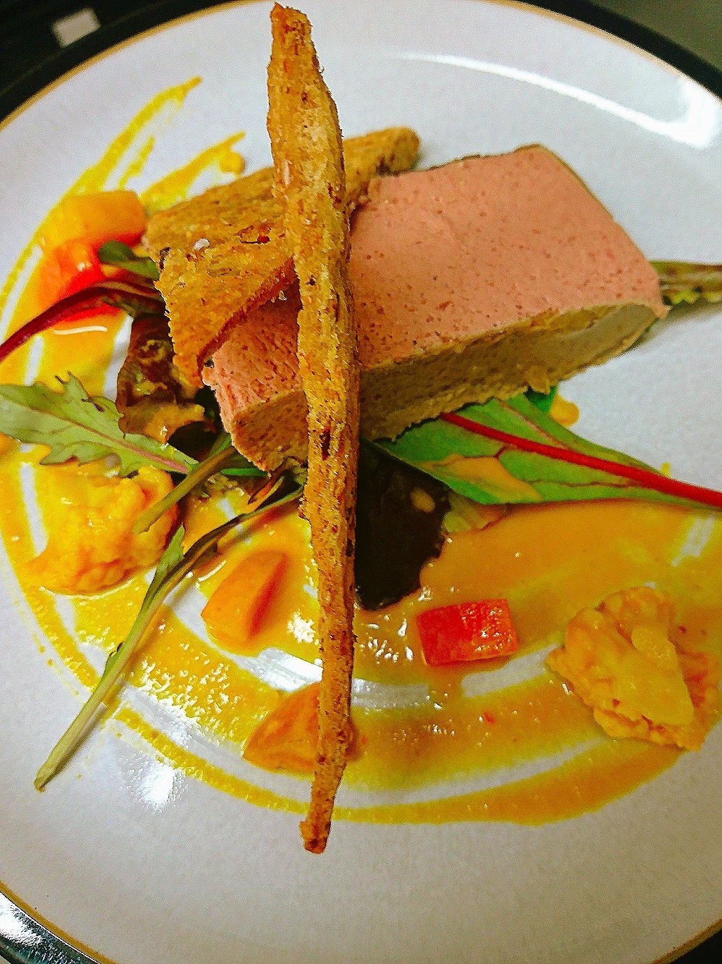 Chicken liver parfait on bed of house leaves, homemade piccalilli, wholemeal wafers